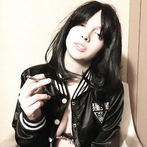 Brunette with big natural tits smoking