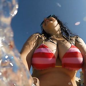 Busty Bikini MILF: Britney Swallows topless. Big tits public swimming pics. - big boobs